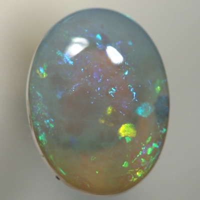 SOLID CRYSTAL OPAL Sparkles of green with orange in a 3D pattern